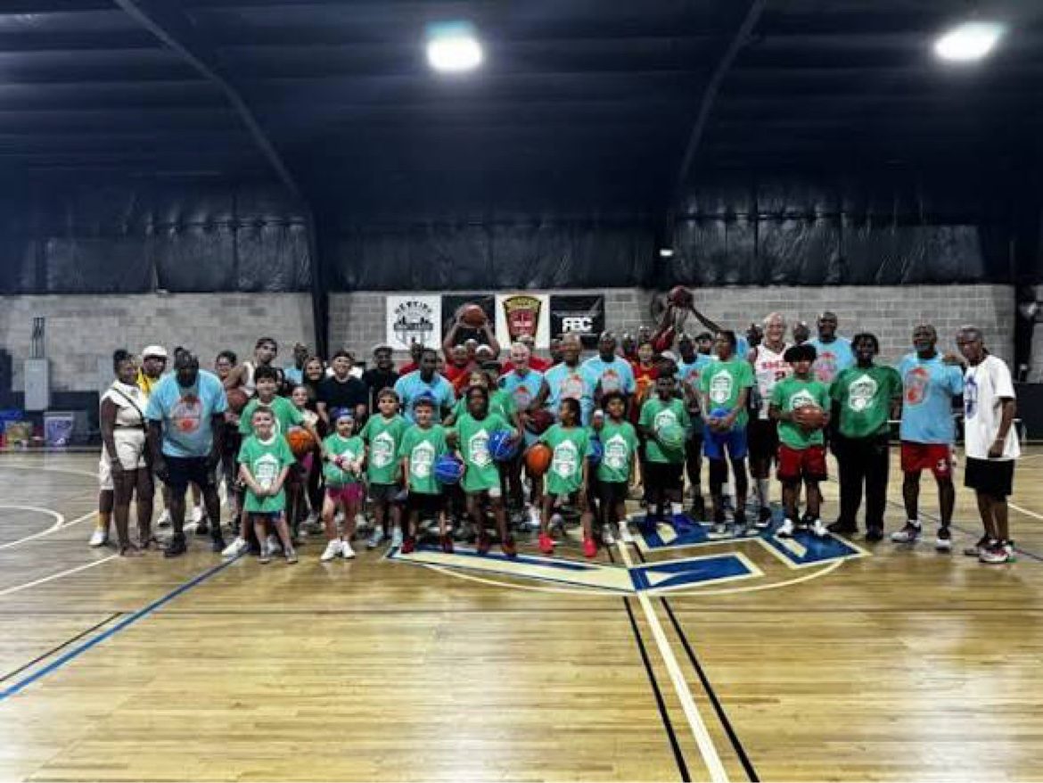 Youth basketball group gathered in the gym